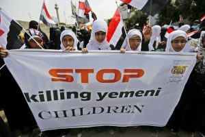 Girls demonstrate against the Saudi-led coalition outside the offices of the United Nations in Yemen's capital Sanaa